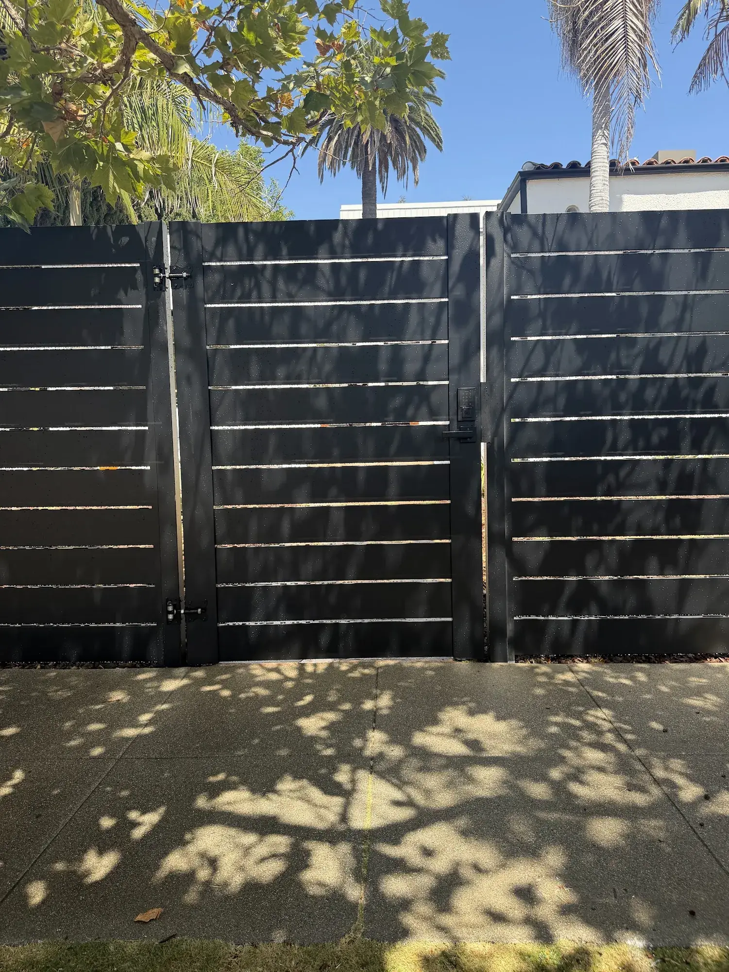 Black aluminum semi-privacy fence & motorized rolling gate in Los Angeles, CA — photo 3 of 4