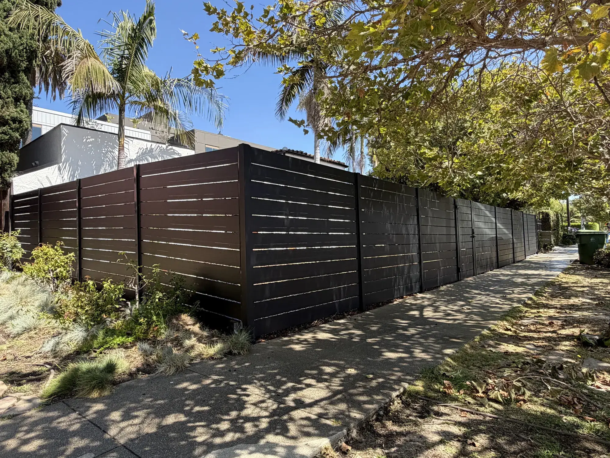 Black aluminum semi-privacy fence & motorized rolling gate in Los Angeles, CA — photo 4 of 4